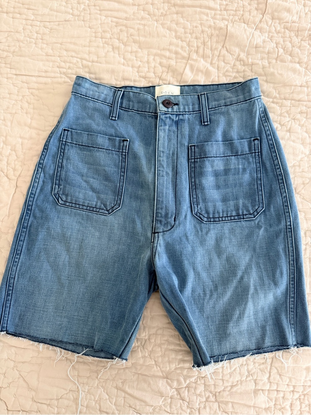 Doen women’s Light Wash Denim Utility Shorts has been cut! RAW HEM